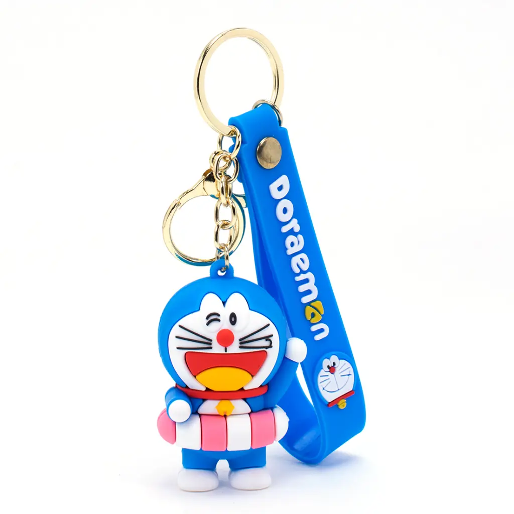 Winking Doraemon In Tube Figure Keychain - Anime Robotic Cat Accessory with Blue Logo Strap | 
